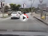 Brazilian Motorcyclist Kicks Car Before Ending Face First On Street