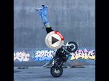 Madcap Biker Pulls Off Insane Handstand While Doing A Wheelie - Video