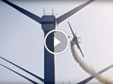 Red Bull Flies Stunt Plane Through Windmill Farm - Video