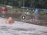 A Group Of Men Save A Man From being Washed Away Into A River In Pune