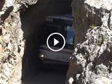 Watch A Talented Bus Driver Pass Through A Narrow Rock Tunnel