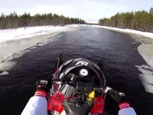 Snowmobile Wheelies Across A River