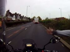 Pedestrian Slaps Motorcyclist While Riding