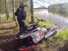 Snowmobile Rides On Water Before Jumping Across Bridge