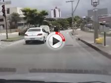 Brazilian Motorcyclist Kicks Car Before Ending Face First On Street