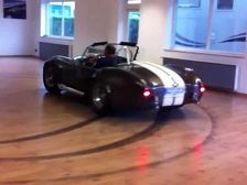 Shelby Cobra Performing Burnouts In An Apartment