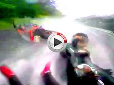 Rider Holds Onto His Pillion As They Tumble Off Their Motorcycle