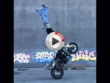 Madcap Biker Pulls Off Insane Handstand While Doing A Wheelie - Video