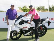 Tiger Woods Checks Out Hero Karizma ZMR Motorcycle