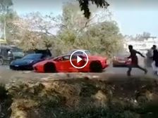 Supercars On The Run As Mad Mob Pelts Them With Stones