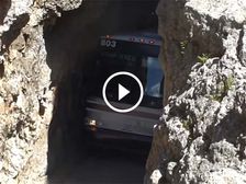 Watch A Talented Bus Driver Pass Through A Narrow Rock Tunnel