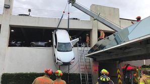 Lexus NX Dangles Precariously Out Of Second Storey Parking Garage With Driver Inside