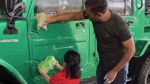 MS Dhoni’s Daughter Ziva Lends A Helping Hand In Washing Nissan Jonga