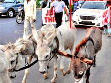 సర్వీస్‌పై విసిగెత్తిన ఓనర్; కారును గాడిదలకు కట్టేసిన వైనం