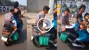 [వీడియో] కదిలే స్కూటర్ మీద హోమ్ వర్క్ చేస్తున్న పిల్లాడు