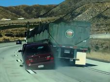 Watch An Unaware Truck Driver Dragging A Car And Its Driver After An Accident