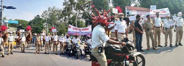 कोरोना वायरस से बचाव के लिए हैदराबाद ट्रैफिक पुलिस ने निकाली रैली, पहने कोरोना हेलमेट