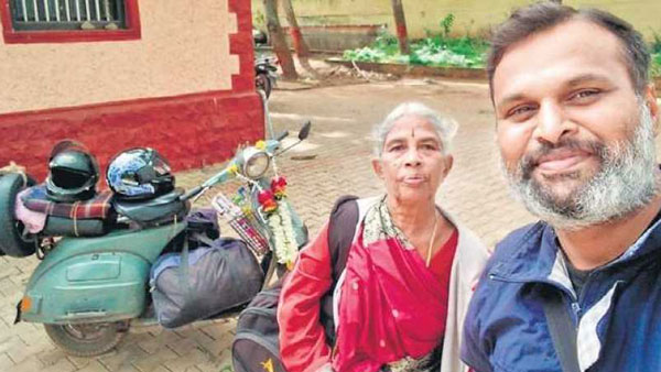 स्कूटर से मां को तीर्थ यात्रा कराने वाले व्यक्ति को आनंद महिंद्रा ने दी नई केयूवी100