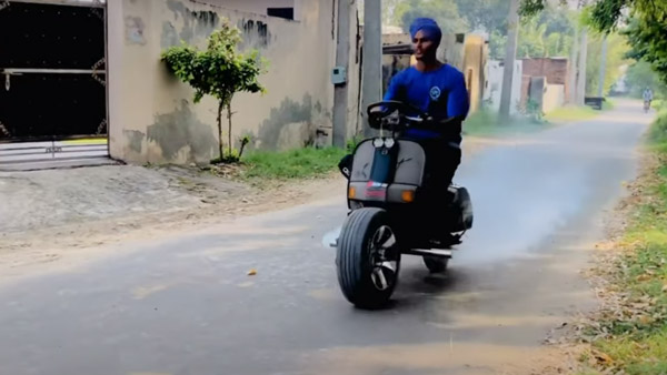 Scooter with steering wheel and fire exhaust