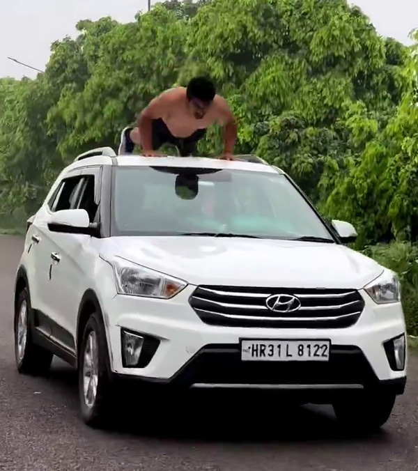 Man Does Push-ups On Moving Hyundai Creta Top