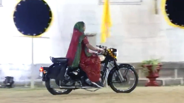 Women Performing Garba On Bikes And Jeeps Women Performing Garba On Bikes And Jeeps