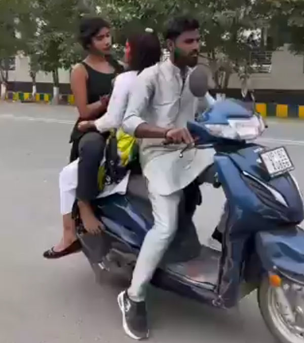 Girls Playing Holi on Running Scooty