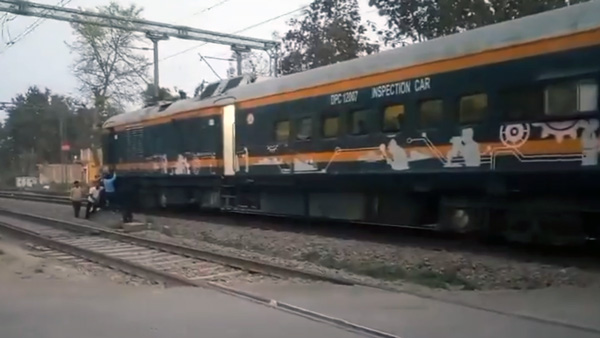 Railway Staff Pushes Train Coach