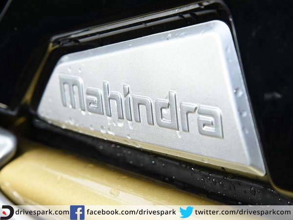 mahindra mojo review petrol tank logo