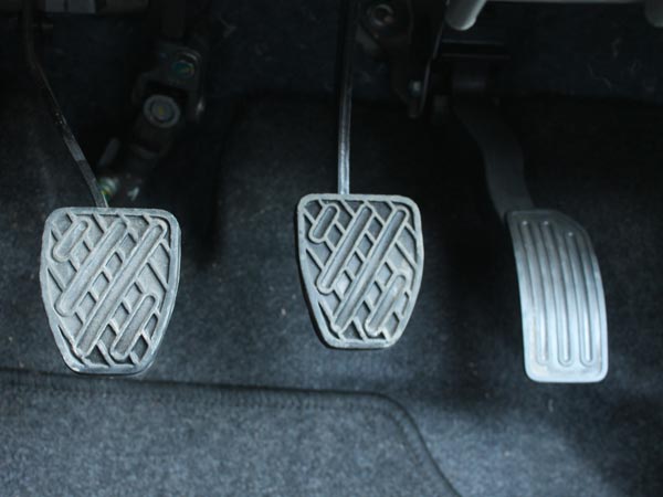 Keep your left foot on the dead pedal or away from the clutch