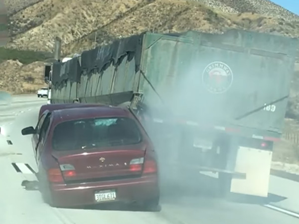 Bizarre: Oblivious Truck Driver Drags Wrecked Car Across Highway 