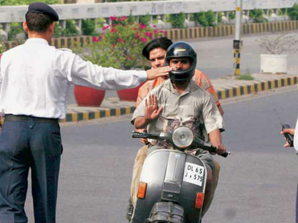 Riding Without Helmet — Woman Kicks Cop
