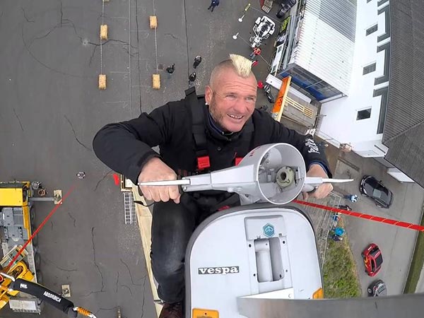 guenter-schachermayr-to-ride-motorcycle-on-steel-cable-suspended-between-black-haw -helicopters