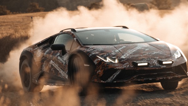 Lamborghini Sterrato Takes On A Dirt Bike In First Teaser For Rally-Prepped Supercar