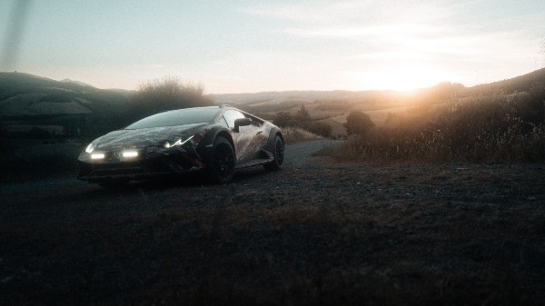 Lamborghini Sterrato Takes On A Dirt Bike In First Teaser For Rally-Prepped Supercar