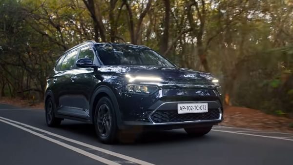 kia carens running shot