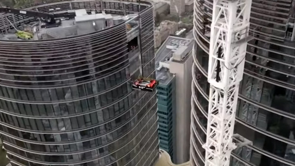 McLaren Senna GTR lifted to 57th floor apartment