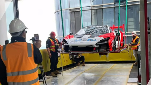 McLaren Senna GTR lifted to 57th floor apartment