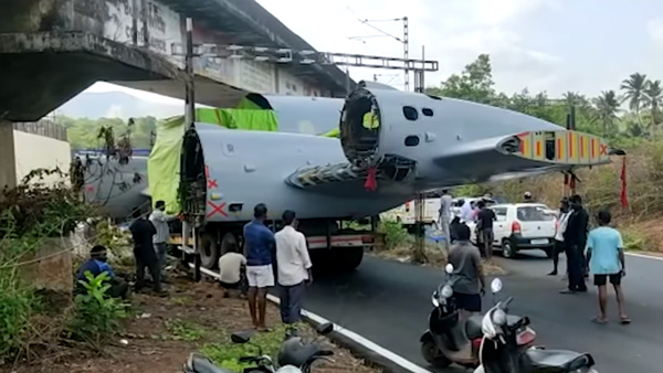 Truck carrying aircraft gets stuck under the bridge in Goa 
