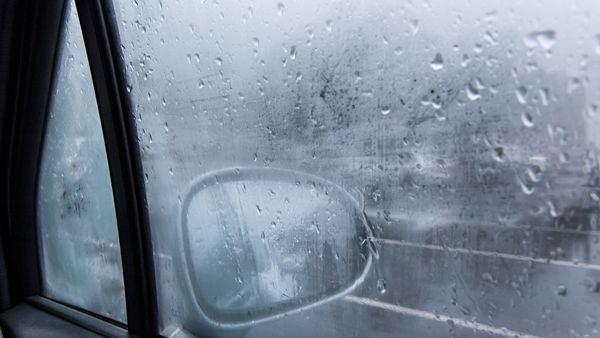 Closed car window during rain