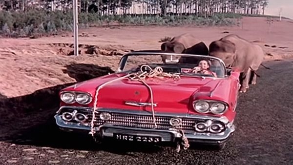 A romantic scene in an automobile depicting the love between characters