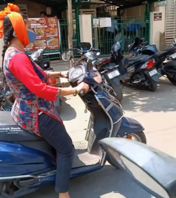 Lady Talks On The Phone While Riding
