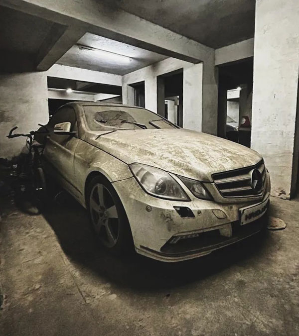 Abandoned Luxury Cars Symbolize Wasted Wealth