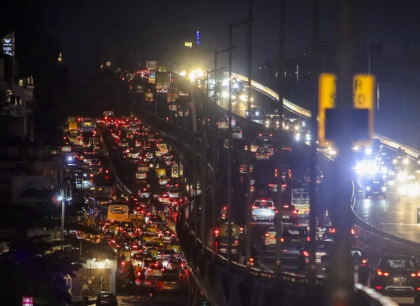 Vehicles stuck in a traffic jam on a road after heavy rainfall in Bengaluru