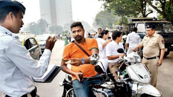 ಹೆಲ್ಮೆಟ್ ಹಾಕದ ಬೈಕ್ ಸವಾರನ ಮೇಲೆ ಶೂ ಎಸೆದ ಟ್ರಾಫಿಕ್ ಪೊಲೀಸ್..