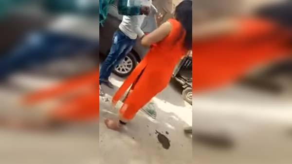 ನಡುರಸ್ತೆಯಲ್ಲೇ ಗನ್ ಹಿಡಿದು ಆಟೋ ಚಾಲಕನಿಗೆ ಬೆದರಿಕೆ ಹಾಕಿದ ಲೇಡಿ...