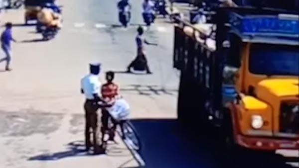 ಯಮರೂಪಿ ಟ್ರಕ್‍‍ನಿಂದ ಬಾಲಕನ ಪ್ರಾಣ ಉಳಿಸಿದ ಪೊಲೀಸಪ್ಪ..!