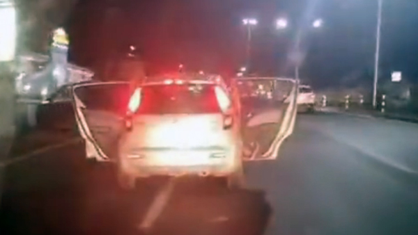 Man Drives Car With Doors Open 