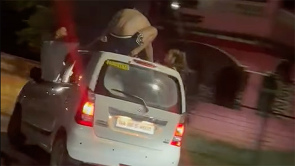 foreign-tourist-stunts-moving-car-goa