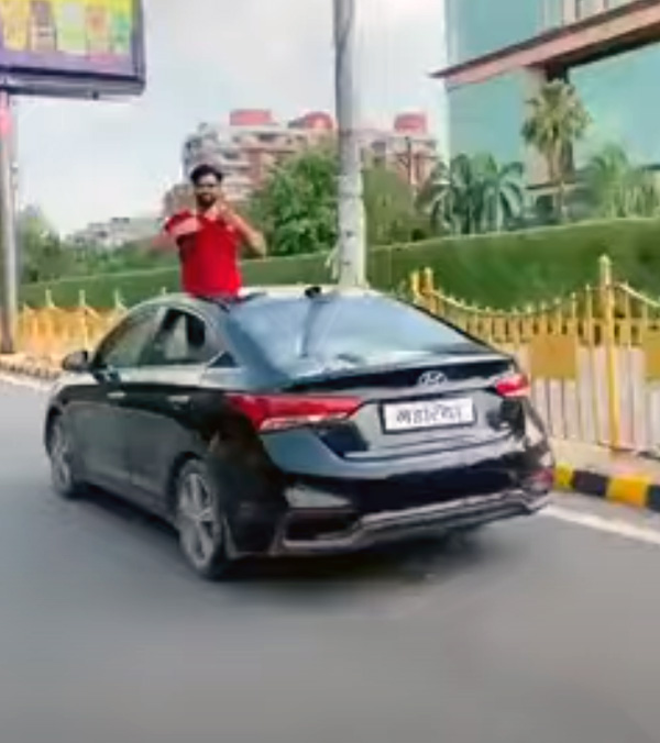 half-naked-man-out-of-moving-sunroof