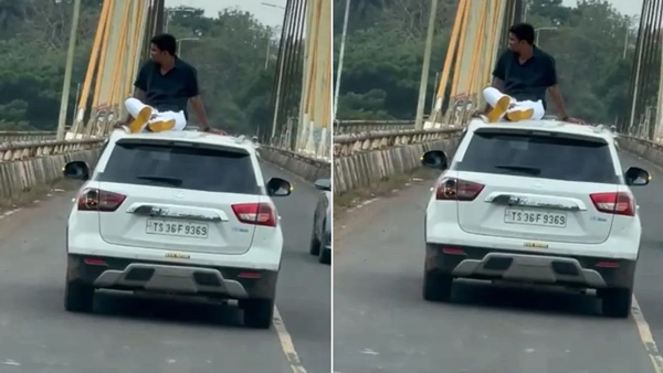 Police apprehend tourist sitting on the roof of a Maruti Suzuki Brezza for dangerous behavior